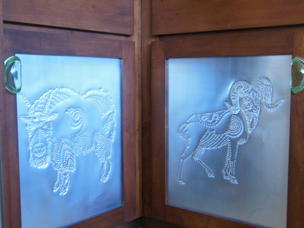 Hand punched pin door panel