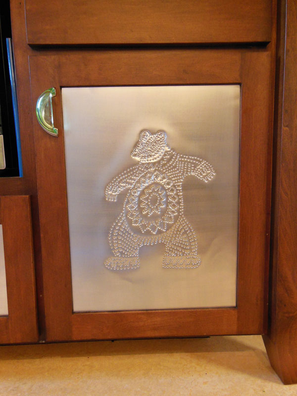 Hand punched pin door panel